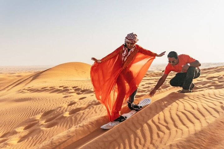 Adventure through golden sands with exhilarating sandboarding camel rides and cultural experiences in the Dubai desert all while enjoying a VIP buffet under the stars.